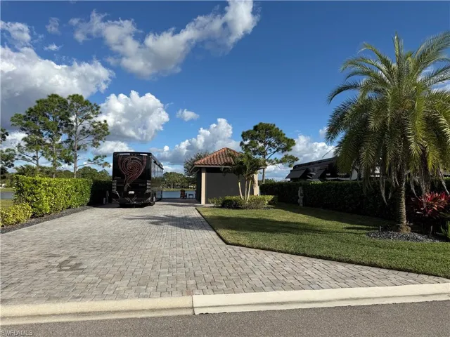 View of front of house featuring a front yard and driveway