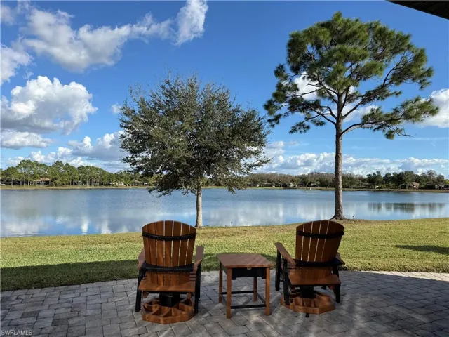 View of patio / terrace featuring an outdoor fire pit and a water view
