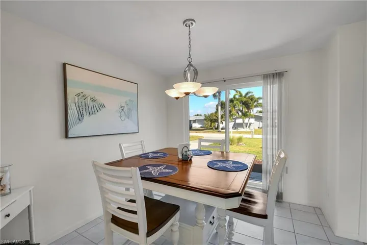 Dining open to living room and kitchen.