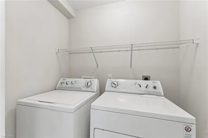 Washroom featuring washer and dryer