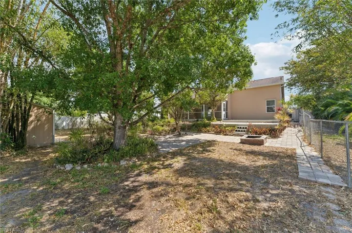 View of yard featuring fence
