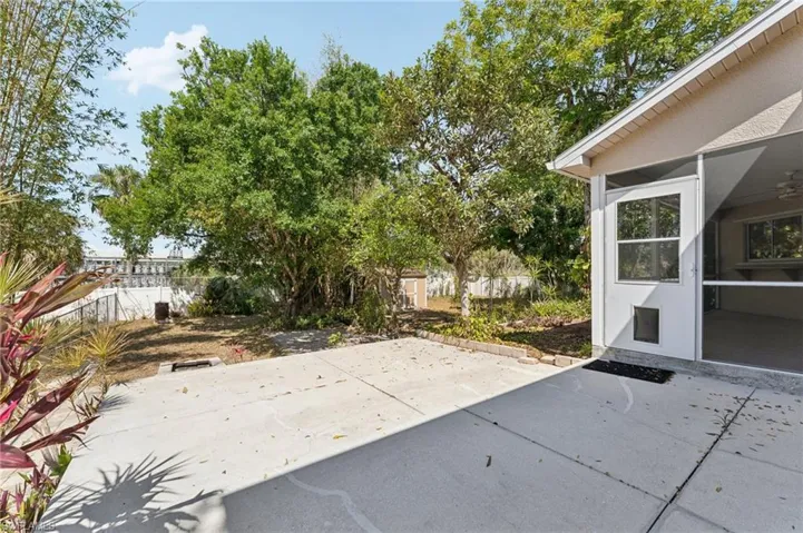 View of patio featuring fence