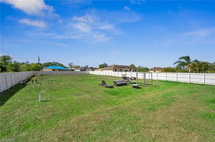 View of fenced backyard