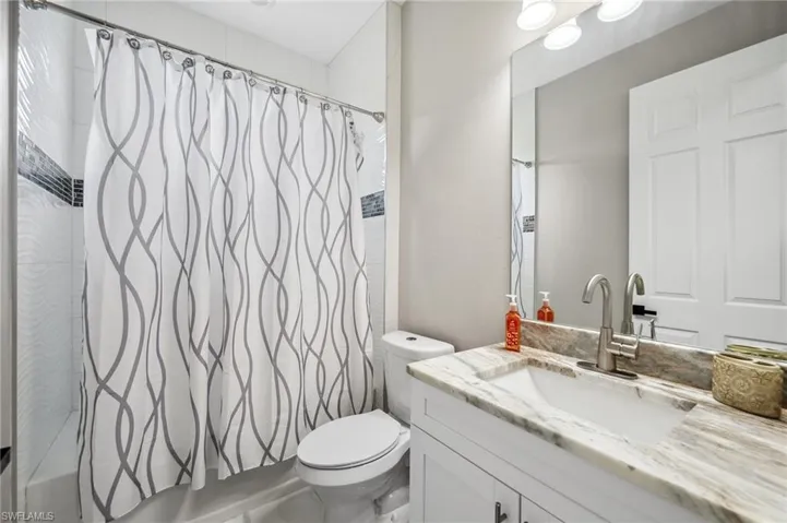 Full bathroom #2  with vanity and shower / tub combo