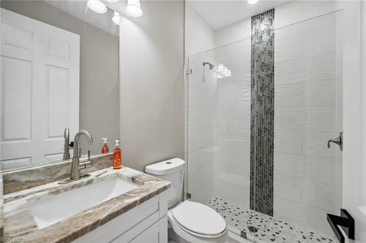 Bathroom #3 with vanity and a stall shower