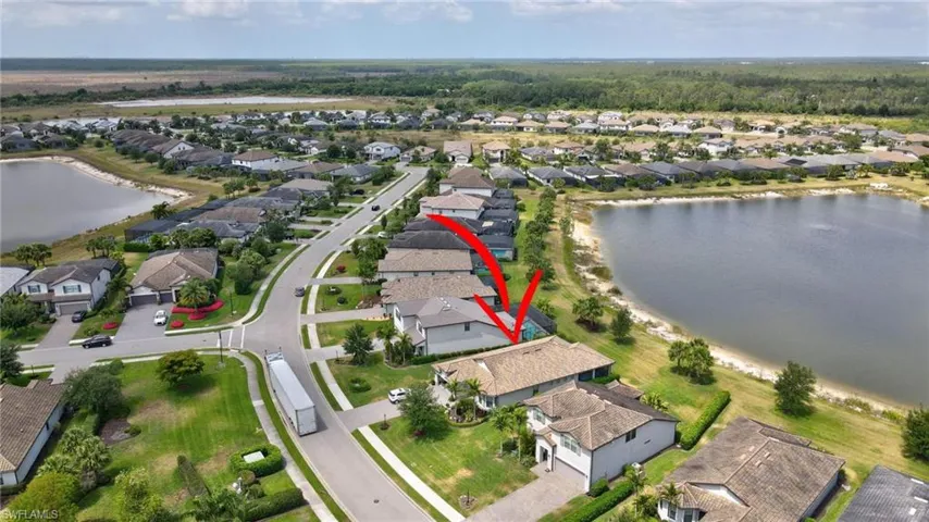 Drone / aerial view featuring a water view and a residential view