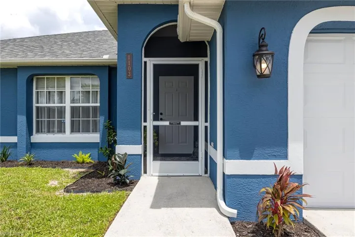 Vibrant blue stucco exterior with contrasting white trim