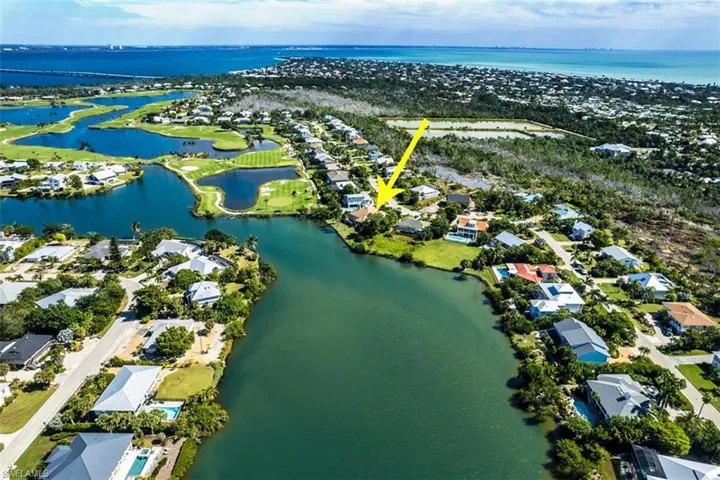 Aerial view of residential area with a large body of water