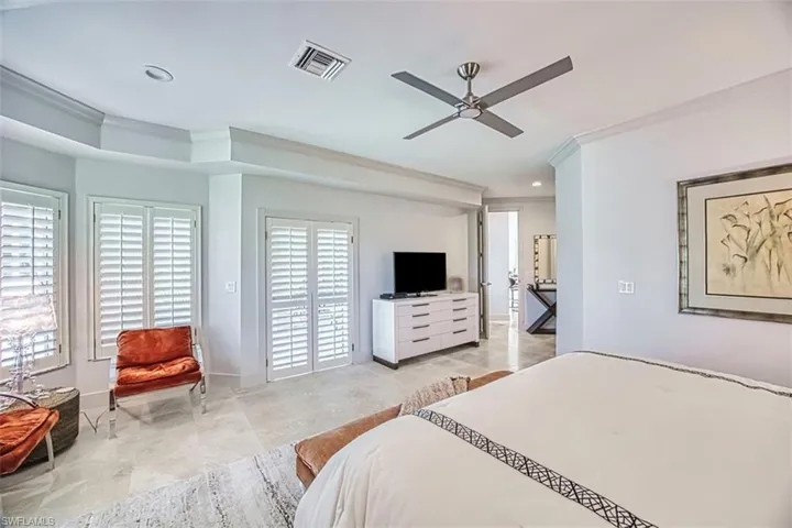 Bedroom featuring a ceiling fan, ornamental molding, and recessed lighting