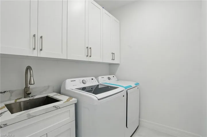 Washroom with independent washer and dryer and cabinet space