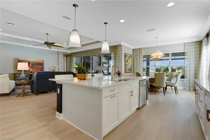 Kitchen featuring a sink, light wood-style floors, and visible vents