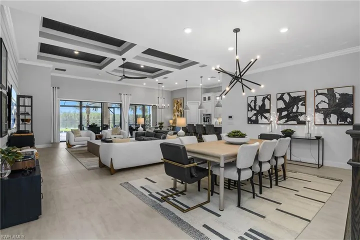 Open dining, great room, kitchen, and cafe area with seamless blend to the outdoor living space.