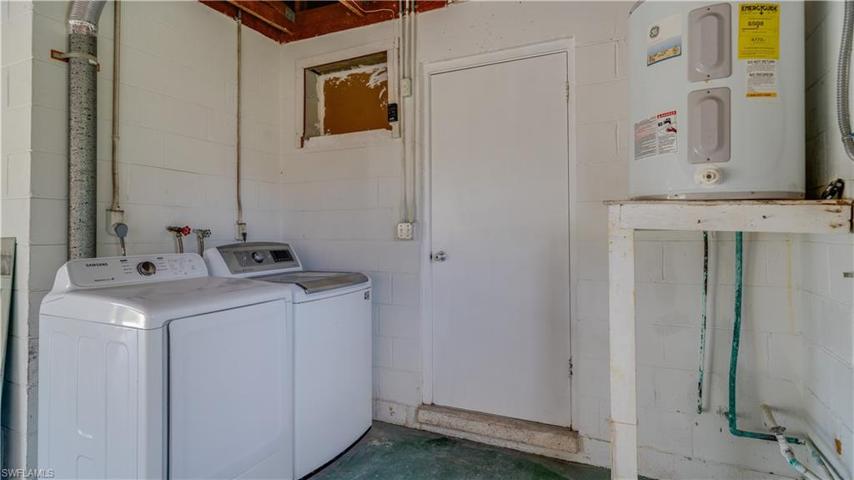 The washer and dryer are currently housed in the oversized garage.