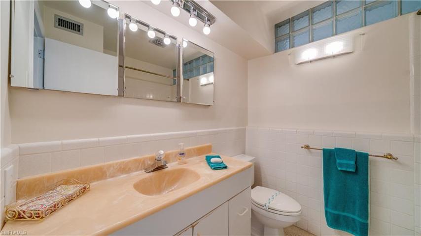 The guest bath, complete with a tub and shower combo, can be updated, remodeled, or renovated.