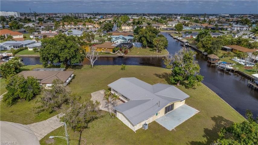 Look at this lot. Look at this view. The possibilities are truly endless! This retro style home is 8 minutes | .6 miles | 1 bridge to open water and your waterfront wonderland! The metal roof 2013!