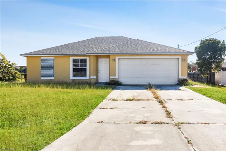 Ranch-style house with roof with shingles, concrete driveway, and stucco siding