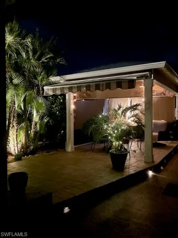Patio at twilight with outdoor dining space