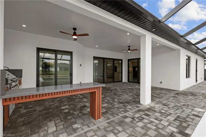 View of patio featuring ceiling fan