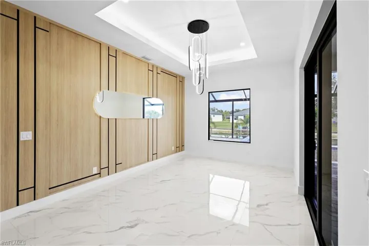 Unfurnished room featuring a raised ceiling