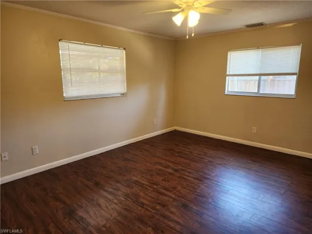 Back Guest Bedroom featuring wood flooring