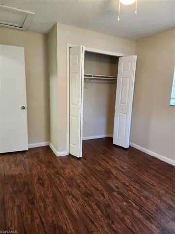 Back Guest Bedroom Closet with ceiling fan and light