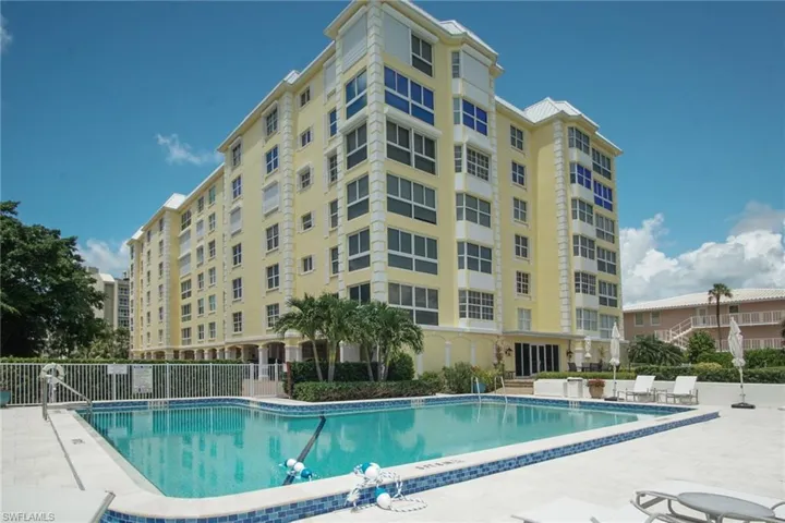 Community pool featuring a patio