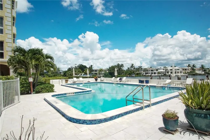 Community pool featuring a patio