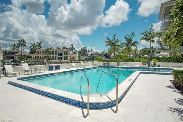 Community pool with a patio area