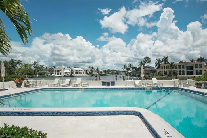 Community pool featuring a patio