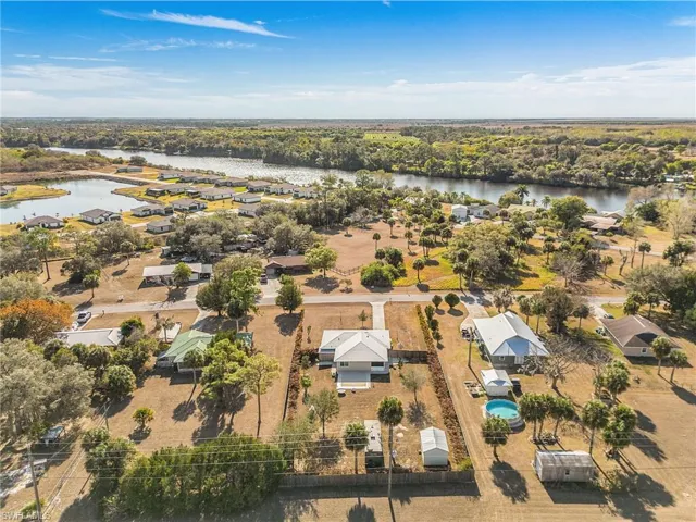 View of property location with a large body of water and nearby suburban area