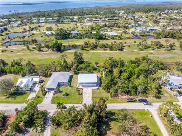 Birds eye view of property featuring a residential view and a water view