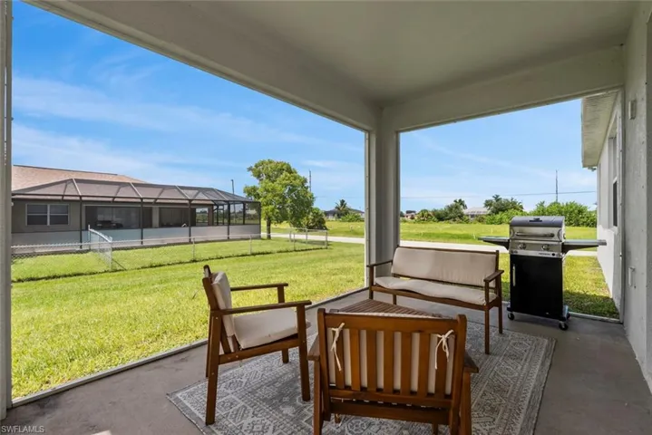 View of patio / terrace featuring glass enclosure and grilling area