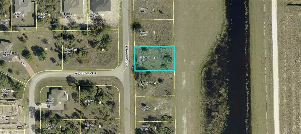 Aerial overview of property's location featuring property parcel outlined