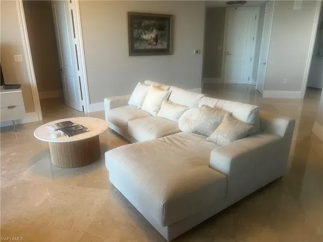 Living area featuring baseboards