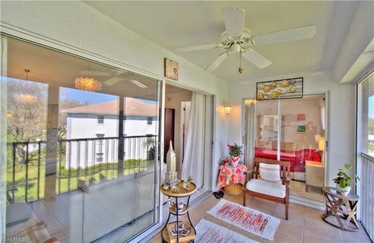 Sunroom / solarium featuring tile patterned floors