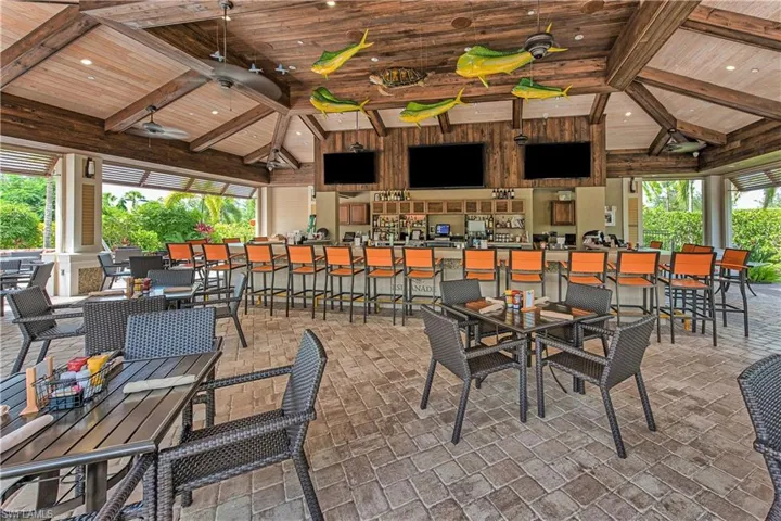 View of patio featuring a gazebo, ceiling fan, and an outdoor bar