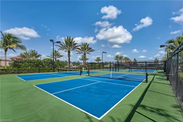 View of tennis court featuring basketball court
