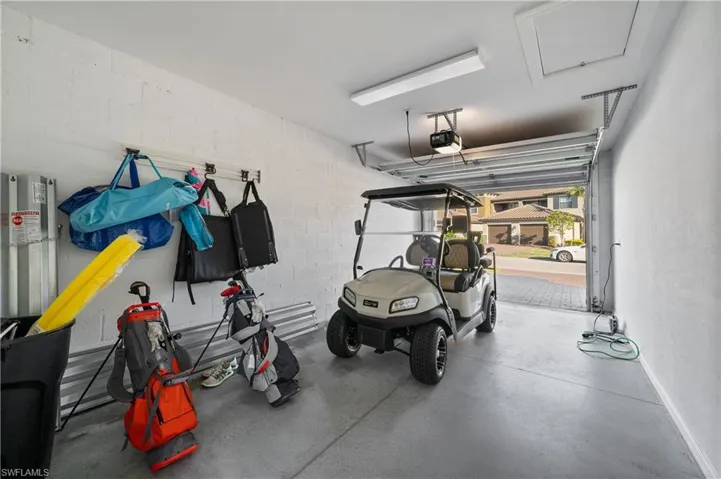 Garage featuring a garage door opener