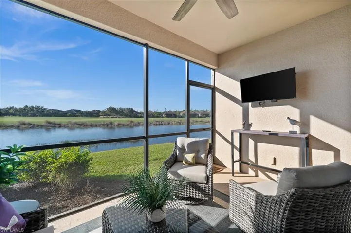 Sunroom featuring ceiling fan