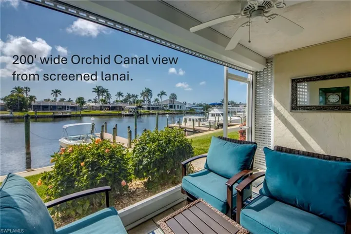 Relax next to the water within this screened lanai.