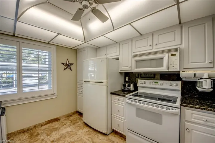 Pantry is on left side of refrigerator. Plenty of storage space in the kitchen.