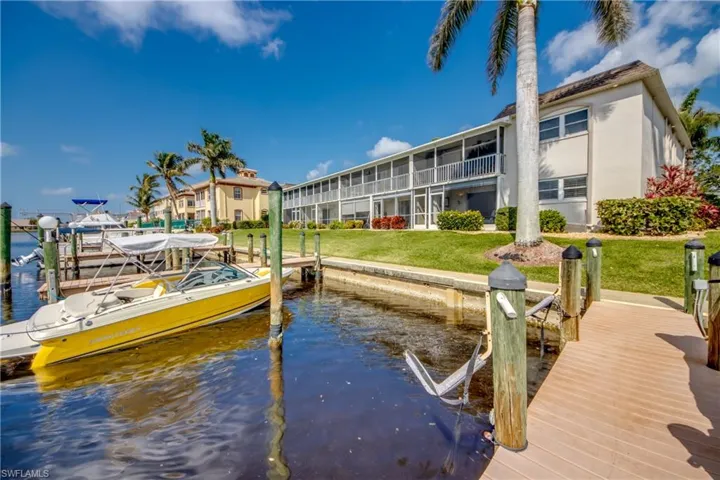 Each unit has an assigned dock space. Photographer is standing on A1 assigned dock and looking back at unit A1, bottom right. Just a few steps from lanai to dock.