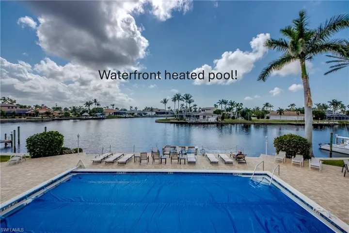 Heated community pool is in center of property and has a great view of the Gulf access canal.