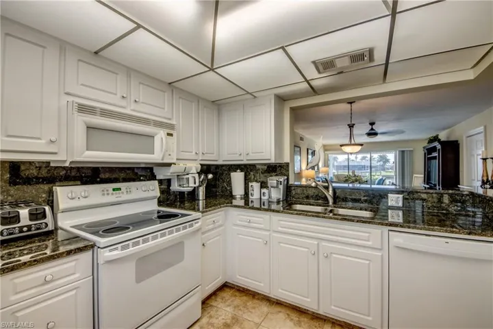 Beautiful, bright kitchen has lots of storage and newer dishwasher.