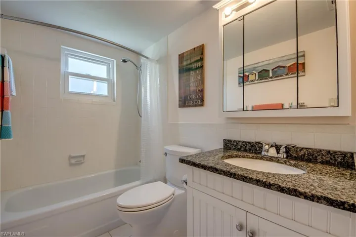 Bathroom #2 has a combo tub/shower and granite topped vanity.