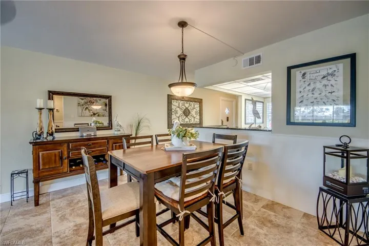 Spacious dining area is in the center of the unit with easy access to kitchen.