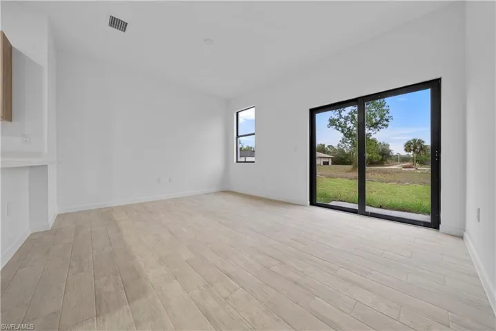 Unfurnished room with light wood finished floors