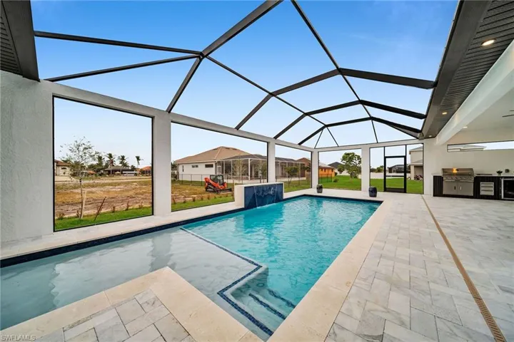 Outdoor pool with glass enclosure, a grill, a lawn, area for grilling, and a patio