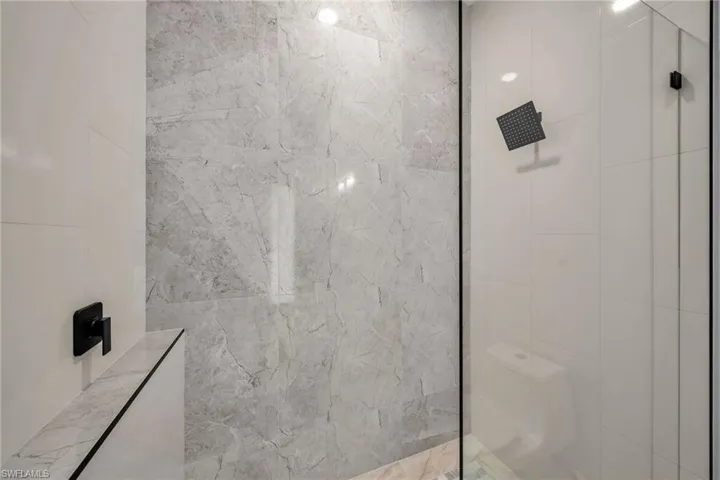 Bathroom featuring tiled shower