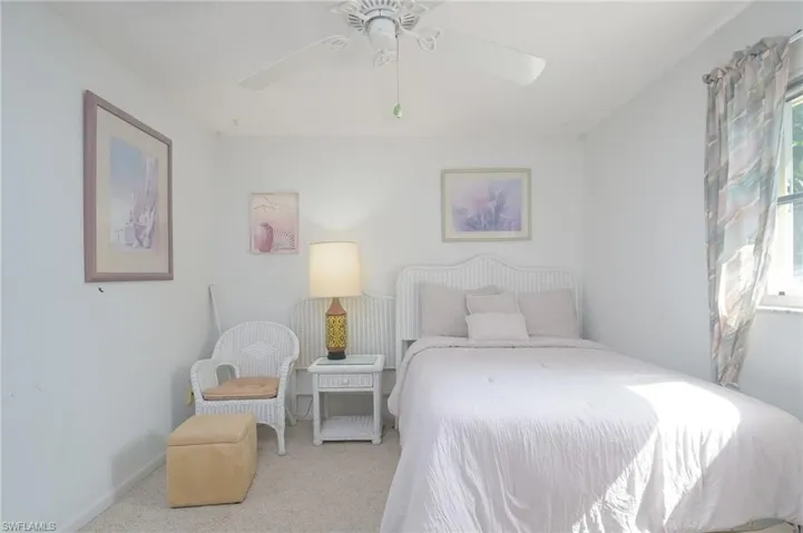 Bedroom with carpet and ceiling fan